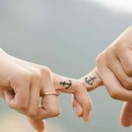 Couple Holding Fingers