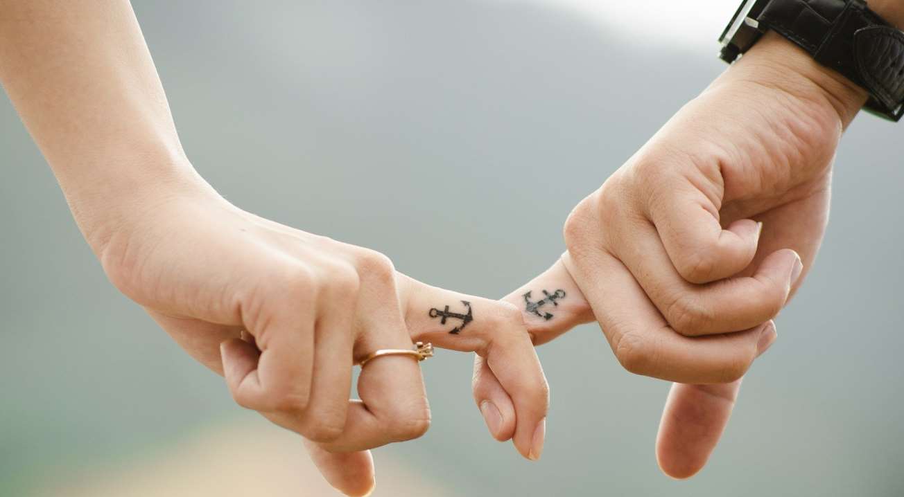 Couple Holding Fingers