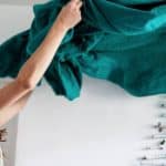 woman holding green textile