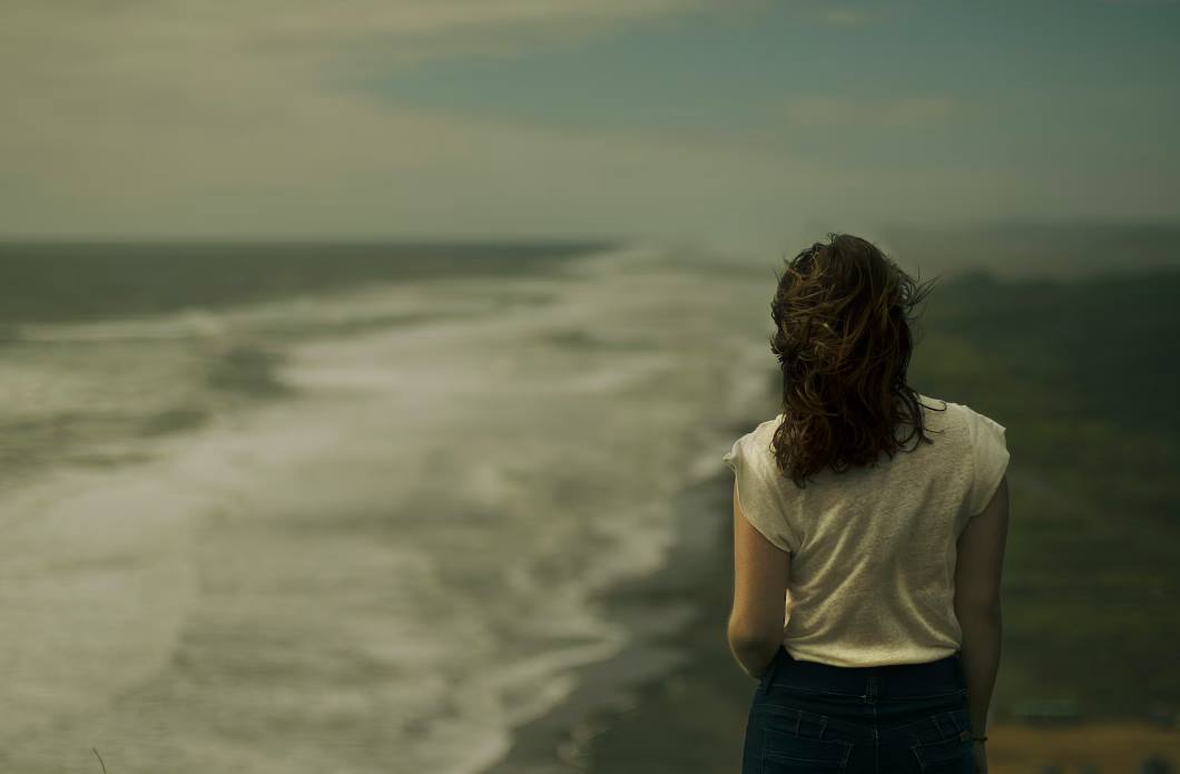 woman standing near seashore