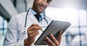 Healthcare And Medicine. Doctor using a digital tablet