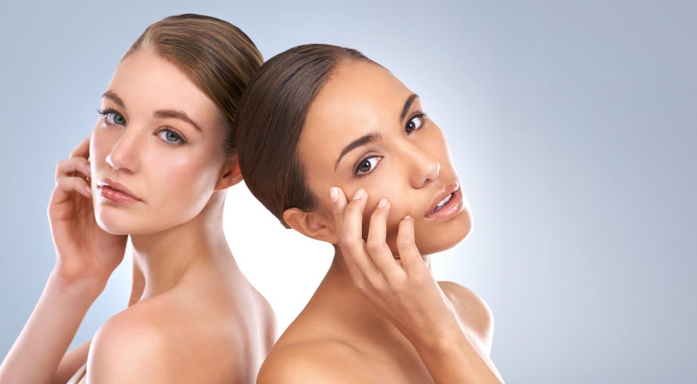 Two women, young and mature, with glowing skin, showcase the effects of anti-aging treatments for a youthful complexion.